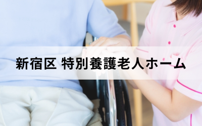 スタッフが車椅子に乗っている利用者の手に自分の手を添えている