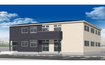 認知症高齢者対応「愛の家グループホーム海老名中野」の外観イメージ。青空を背景にしたツートンカラーの2階建ての建物。